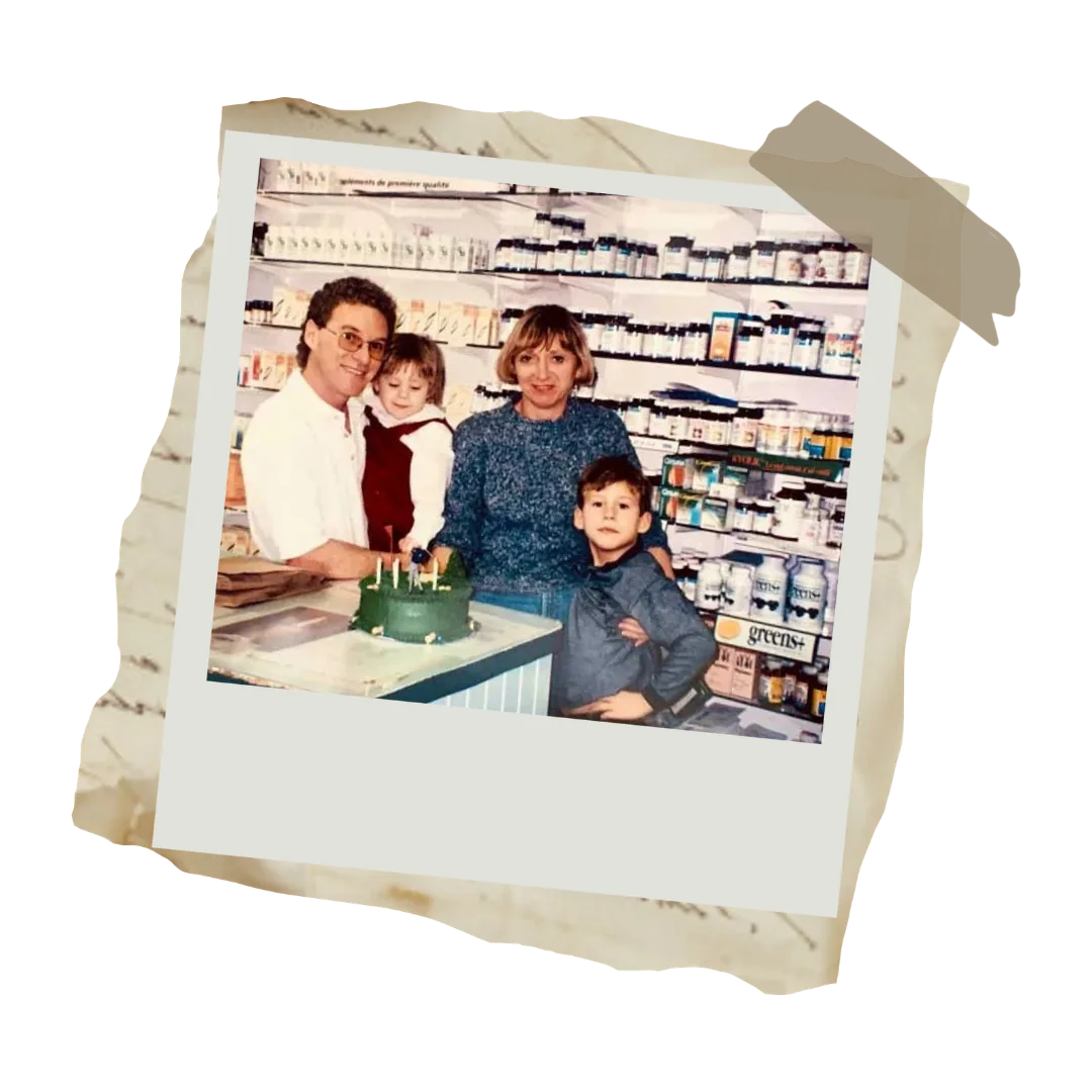 Richard and Rachelle Gagné with their children behind the counter of their natural health store in 1984